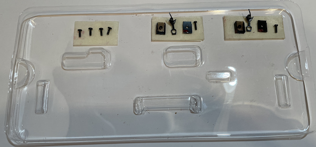 Screws on tray